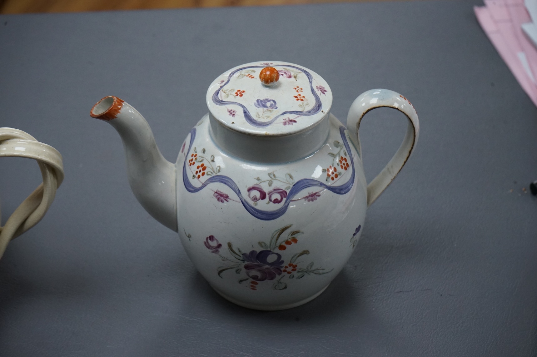 Leeds pottery, a creamware teapot, c.1785 and a pearlware teapot, c.1795, both stamped, tallest 13cm high